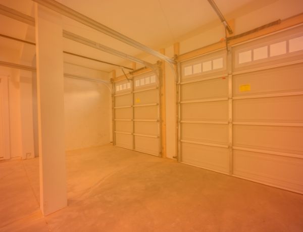 NexGarage technician servicing a residential garage door in Boston, Massachusetts